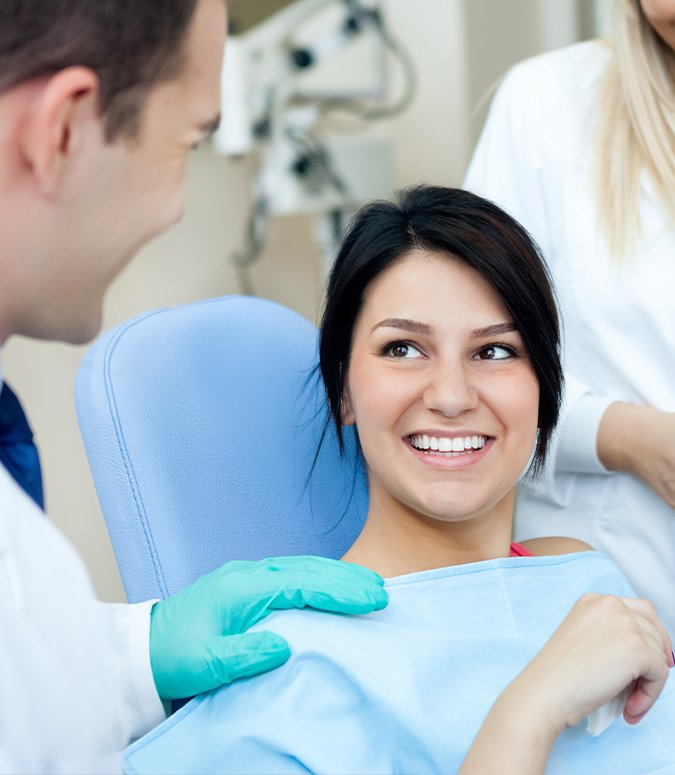 Woman smiling during preventive dentistry checkup visit