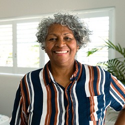 Closeup of woman smiling in living room